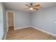 Spacious bedroom with ceiling fan and walk-in closet at 300 Winona Ct, Auburndale, FL 33823