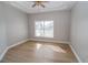 Bright bedroom with hardwood floors and large window at 300 Winona Ct, Auburndale, FL 33823