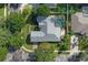 Aerial view of a house with pool and landscaped yard at 109 Costa Loop, Auburndale, FL 33823