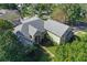 Single-Gathering home with grey roof and stone accents at 109 Costa Loop, Auburndale, FL 33823