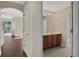 Shared bathroom with double vanity and access to hallway at 109 Costa Loop, Auburndale, FL 33823