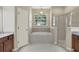 Bathroom featuring a soaking tub, shower, and double vanity at 109 Costa Loop, Auburndale, FL 33823