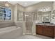 Bathroom with walk-in shower, soaking tub and double sinks at 109 Costa Loop, Auburndale, FL 33823