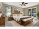 Spacious bedroom with wood furniture and pool view at 109 Costa Loop, Auburndale, FL 33823