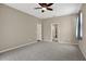 Large bedroom with doors to other rooms and carpet flooring at 109 Costa Loop, Auburndale, FL 33823