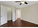 Bedroom with hardwood floors, ceiling fan and walk-in closet at 109 Costa Loop, Auburndale, FL 33823
