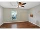 Spacious bedroom with hardwood floors and a large window at 109 Costa Loop, Auburndale, FL 33823