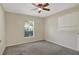 Bedroom with carpet, ceiling fan and window blinds at 109 Costa Loop, Auburndale, FL 33823