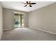 Bright bedroom with sliding doors leading to the pool area at 109 Costa Loop, Auburndale, FL 33823