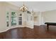 Bright dining room with hardwood floors and chandelier at 109 Costa Loop, Auburndale, FL 33823
