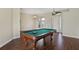 Spacious game room with pool table and hardwood floors at 109 Costa Loop, Auburndale, FL 33823
