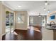 Living room with hardwood floors and view of the pool at 109 Costa Loop, Auburndale, FL 33823