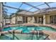 Inviting pool area with covered patio and spa at 109 Costa Loop, Auburndale, FL 33823