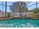 Refreshing screened pool with a spa area at 109 Costa Loop, Auburndale, FL 33823