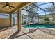 Screened-in pool and spa with brick pavers at 109 Costa Loop, Auburndale, FL 33823