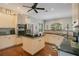 Bright kitchen featuring white cabinetry, stainless steel appliances, and an island at 5936 Coveview W Dr, Lakeland, FL 33813