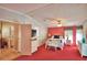 Spacious bedroom with a ceiling fan, dresser, and carpet at 1742 Fox Hill Dr, Lakeland, FL 33810