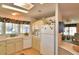 Kitchen with white appliances and a view into the living area at 1742 Fox Hill Dr, Lakeland, FL 33810