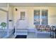 Enclosed porch with wicker furniture and ceiling fan at 1742 Fox Hill Dr, Lakeland, FL 33810
