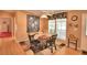 Bright dining room features a round table with four chairs and large window at 1742 Fox Hill Dr, Lakeland, FL 33810