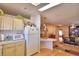 Kitchen features white cabinets, a microwave, and a view to the dining area at 1742 Fox Hill Dr, Lakeland, FL 33810