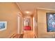 Home hallway with light walls and wood flooring leading to bedrooms at 1742 Fox Hill Dr, Lakeland, FL 33810