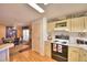 Kitchen with stove, lots of cabinets, and a view into the dining area at 1742 Fox Hill Dr, Lakeland, FL 33810