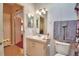 Bathroom with vanity, toilet, and access to another bedroom at 1742 Fox Hill Dr, Lakeland, FL 33810