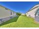Landscaped backyard with grassy area at 1742 Fox Hill Dr, Lakeland, FL 33810