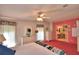 Well-lit bedroom featuring a comfortable bed and vanity area at 1742 Fox Hill Dr, Lakeland, FL 33810