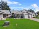 Single-story home with a two-car garage and a well-maintained lawn at 6381 Egret Dr # 29, Lakeland, FL 33809