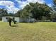 White mid-century modern home with a large backyard at 2128 Sycamore Dr, Winter Park, FL 32789