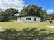 White mid-century modern home with a large backyard at 2128 Sycamore Dr, Winter Park, FL 32789