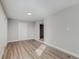 Large living room featuring vinyl flooring and neutral walls at 217 S Kelly St, Lake Hamilton, FL 33851