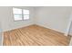 Bright bedroom featuring laminate wood flooring and large window at 2235 Grand Cypress Dr # 561, Lakeland, FL 33810