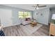 Living room with gray flooring and comfy sofa at 1220 Woodland Ave, Lakeland, FL 33801