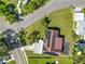 Aerial view of a house, showcasing its solar panels and surrounding neighborhood at 1220 Woodland Ave, Lakeland, FL 33801