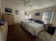 Main bedroom with two beds and ceiling fan at 2115 Cypress Cross Dr, Lakeland, FL 33810