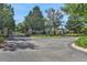 Gated community entrance with stone pillars and lush landscaping at 109 Costa Loop, Auburndale, FL 33823