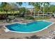 Large community pool with surrounding lounge chairs at 109 Costa Loop, Auburndale, FL 33823