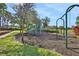 Play area with swings and climbing equipment at 109 Costa Loop, Auburndale, FL 33823