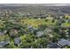 Aerial view of a neighborhood with houses and green spaces at 109 Costa Loop, Auburndale, FL 33823