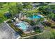 Community pool area with two pools, lounge chairs, and a shaded pavilion at 109 Costa Loop, Auburndale, FL 33823
