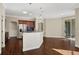 Open kitchen with hardwood floors and an island at 109 Costa Loop, Auburndale, FL 33823