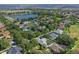 Aerial view of neighborhood with lake and houses at 109 Costa Loop, Auburndale, FL 33823