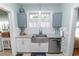 Kitchen features stainless steel appliances, white cabinets, and granite countertops at 308 Allamanda Dr, Lakeland, FL 33803