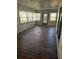 Sunroom with wood-look flooring and access to the outdoors at 4904 Goldenview Ln, Lakeland, FL 33811