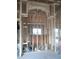 Unfinished kitchen framing with arched entryway at 7391 Orlando Dr, Lake Wales, FL 33855