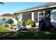 Backyard patio with potted plants and grill at 1015 Highland Crest Cir, Lake Wales, FL 33853