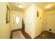 Bright entryway with wood flooring and access to other rooms at 1015 Highland Crest Cir, Lake Wales, FL 33853